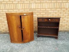 A oval fronted cabinet 94 cm x 67 cm x 44 cm and a two drawer hall cabinet 77 cm x 76 cm x 29 cm.