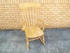 A pine rocking chair.
