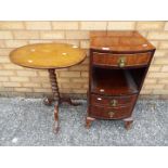 A small oval tilt top table on bobbin turned column and tripod supports,