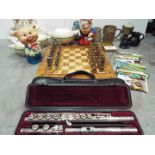 A metal chess set with board, a cased Yamaha flute, a pair of fireside dogs, three Meakin tureens,