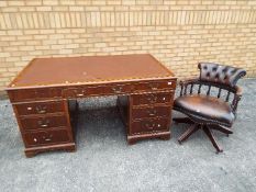 A leather topped pedestal desk, approximately 77 cm x 52 cm x 91 cm and a captains chair.