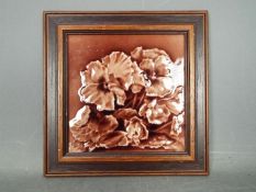 A framed Minton tile,