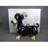 A boxed Pets With Personality model, Einstein the Dachshund,