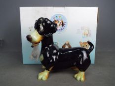 A boxed Pets With Personality model, Einstein the Dachshund,