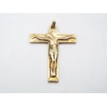 A 9ct gold crucifix pendant, 4.3 cm x 3.3 cm, approximately 8 grams all in.