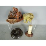 Lot to include a carved soapstone brush washer, bone carving mounted to wooden base,