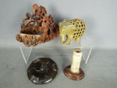 Lot to include a carved soapstone brush washer, bone carving mounted to wooden base,