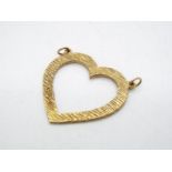 A 9ct gold heart shaped pendant with textured surface, approximately 4.1 grams all in.