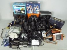 Photography - A collection of cameras, binoculars and similar.