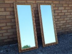 A matched pair of rectangular gilt framed mirrors,