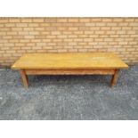 An antique pine coffee table,