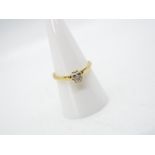 An 18ct yellow gold, illusion set diamond solitaire ring (shank cut), approximately 2.