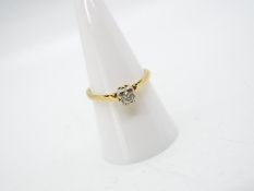 An 18ct yellow gold, illusion set diamond solitaire ring (shank cut), approximately 2.