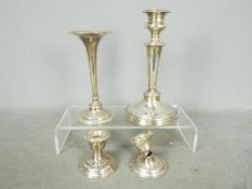 A silver hallmarked candlestick by Mappin and Webb, Sheffield assay 1912 18.