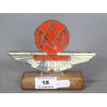 Automobilia - Aston Martin Owners Club car badge on wooden base, approximately 11 cm (h).
