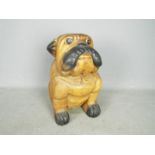 A carved wooden model of a bulldog, approximately 30 cm (h).