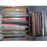 A collection of 12" vinyl records comprising, musical, religious themes, classical, ABBA, Elvis,
