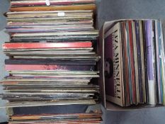A collection of 12" vinyl records comprising, musical, religious themes, classical, ABBA, Elvis,