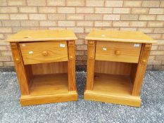 A pair of pine bedside cabinets measuring approximately 61 cm x 52 cm x 43 cm.