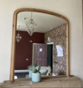 A pine framed over mantel mirror,