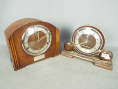 Two mantel clocks comprising a Metamec Electric and one other.