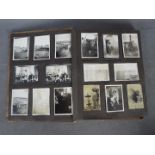 An World War One (WW1 / WWI) period album containing a collection of photographs, postcards,