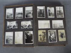 An World War One (WW1 / WWI) period album containing a collection of photographs, postcards,