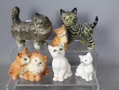 Beswick - Six figurines of cats and kittens, largest approximately 13 cm (h).