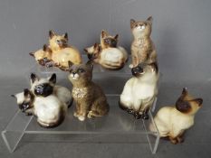 Beswick - Seven figurines of cats and kittens, largest approximately 11 cm (h).