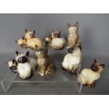 Beswick - Seven figurines of cats and kittens, largest approximately 11 cm (h).