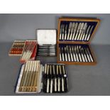 A collection of cased and boxed flatware.