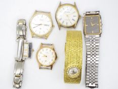 A small collection of wristwatches and watch heads