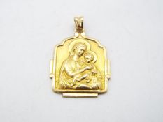 A yellow metal religious pendant (markings unclear but presumed 9ct) with depiction of the Madonna