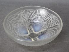 A Lalique opalescent Coquilles bowl, # 3204, relief moulded to the exterior with overlapping shells,