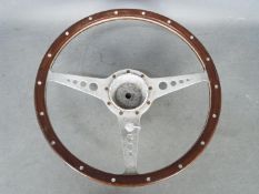 Automobilia - Jaguar: A wood rimmed 15" (38 cm) E Type steering wheel.