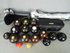 A collection of bowls and golf clubs.