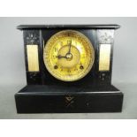 A cast iron cased mantel clock by Ansonia, USA,