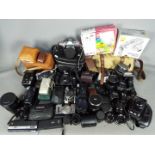 Photography - A large quantity of cameras, lenses and accessories.
