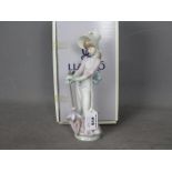 Lladro - A boxed figurine entitled Garden Song, # 7618,