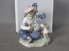 Lladro - A boxed figural group entitled I Hope She Does, # 5450, approximately 14 cm (h).