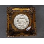 A composite marble plaque after Enrico Braga depicting putti playing instruments set in a gilt