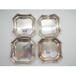 A set of four hallmarked silver, shallow dishes of shaped form, Birmingham assay,