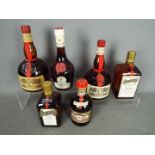 Six bottles of alcoholic drink comprising two 1 litre bottles of Grand Marnier,