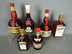 Six bottles of alcoholic drink comprising two 1 litre bottles of Grand Marnier,