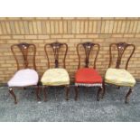 Four upholstered chairs.