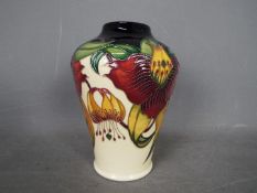 Moorcroft - a Moorcroft vase in the Anna Lily design,