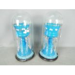 A pair of blue glass lustres with hand painted decoration of gilt and white (quite extensively