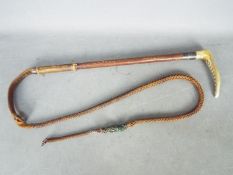 A vintage antler handled hunting whip by George Parker & Sons,
