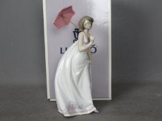 Lladro - A boxed Collectors Society figurine for 1995 entitled Afternoon Promenade, # 7636,