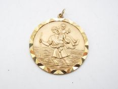A 9ct gold St Christopher pendant, 3.5 cm (d), approximately 12.5 grams all in.